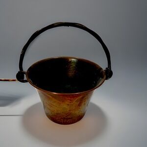 Hammered copper pot with a wrought iron handle, made by Stockli Netstal. VINTAGE